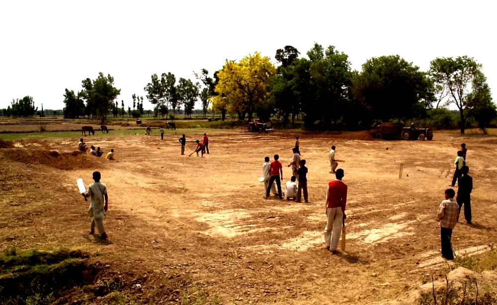 image of children playing cricket in a village ground short scary stories
